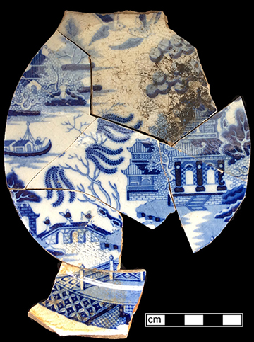 Pearlware soup plate printed underglaze in medium blue in the Blue Willow pattern.  Printed mark on reverse “Riley’s Semi China” and an impressed asterisk.  John and Richard Riley 1802-1828), Burslem.